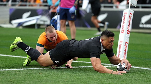 Caleb Clarke of New Zealand scores the opening try.