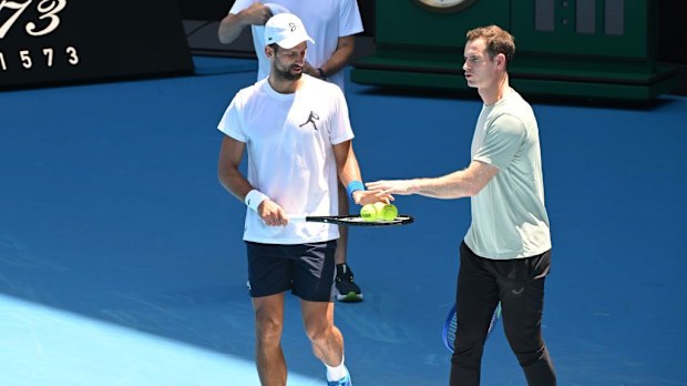 Novak Djokovic of Serbia with coach Andy Murray during a practice session.
