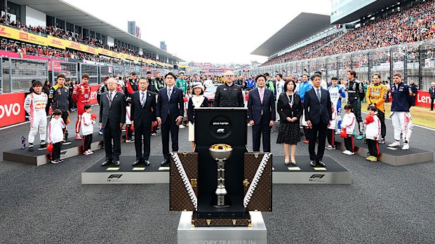 The drivers stand for the national anthem on the grid prior to the F1 Grand Prix of Japan at Suzuka Circuit.