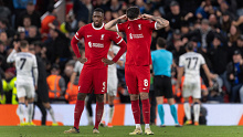 Dominik Szoboszlai and Ibrahima Konate of Liverpool look dejected after Atalanta's third goal.