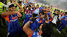 Tilak Varma, Ishan Kishan, Arshdeep Singh and Mohammed Siraj of India celebrate following the ICC Men's T20 World Cup.