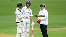 Umpire Nathan Johnstone confirms to Peter Handscomb he is out.