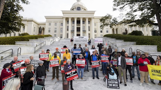 Nearly one hundred protestors gather at the state capitol building in Montgomery, Ala., on Tuesday, Jan. 23, 2024, to ask Gov. Kay Ivey to stop the planned execution of Kenneth Eugene Smith. (Mickey Welsh/The Montgomery Advertiser via AP)