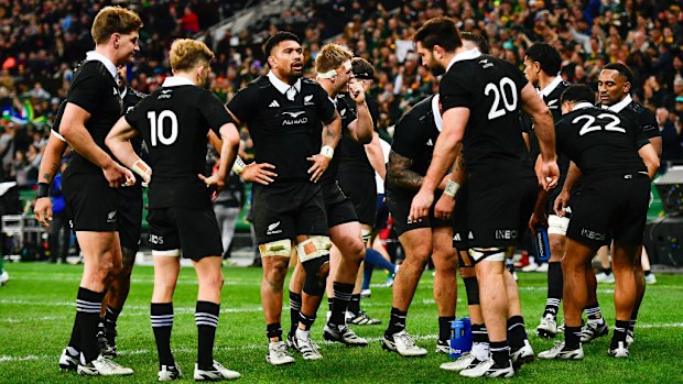 The All Blacks are dejected after a try to Malcolm Marx of the Springboks.