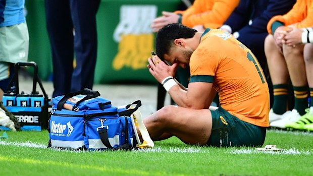 Tom Wright of Australia is injured.