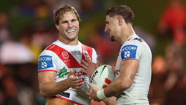 Jack de Belin celebrates scoring a try with Zac Lomax.