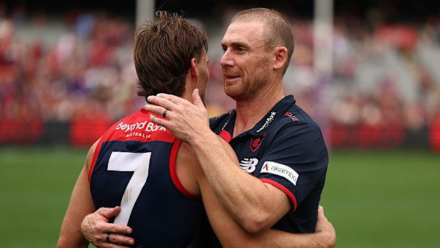 Melbourne Coach Simon Goodwin and Jack Viney of the Demons embrace.