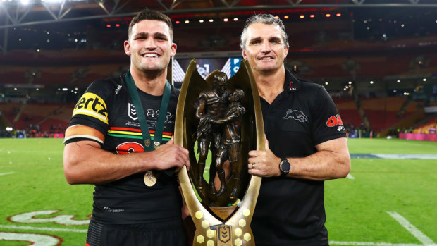 Nathan and Ivan Cleary holding the premiership trophy.