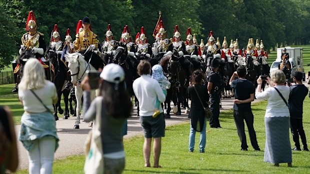 Members of the Household Cavalry make their way down the Long Walk towards Windsor Castle ahead of the ceremony.