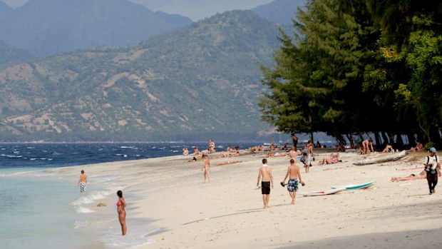 Tourists on a beach off Lombok. (AAP)