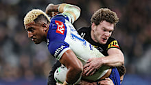 Viliame Kikau of the Bulldogs is tackled by Liam Martin.