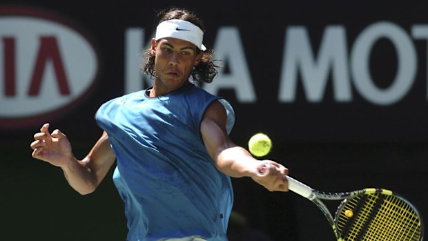 Spain's Rafael Nadal plays a powerful forehand during his match against Australia's Lleyton Hewitt.