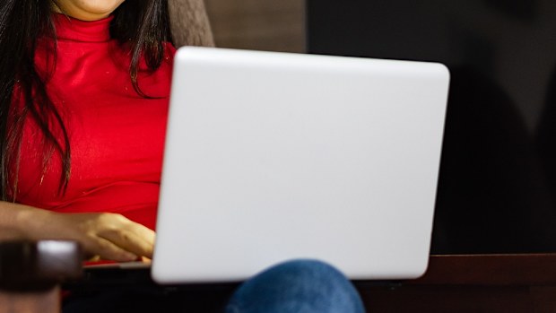 Woman using laptop at home