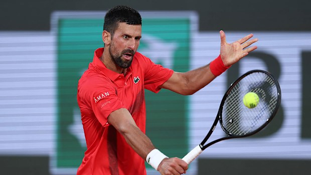 Novak Djokovic of Serbia plays a backhand against Filip Misolic of Austria.