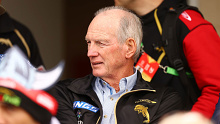 Dolphins coach Wayne Bennett watches on from the stands.