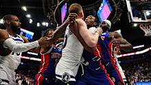 Ronald Holland II #00 of the Detroit Pistons and Donte DiVincenzo #0 of the Minnesota Timberwolves fight in the second quarter. Holland II and DiVincenzo were ejected from the game at Target Center on March 30, 2025 in Minneapolis, Minnesota. 