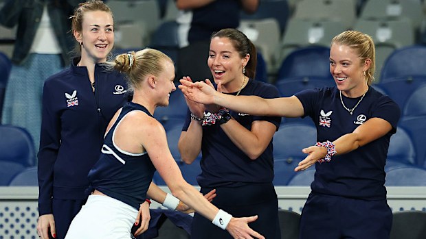 Harriet Dart of Great Britain is congratulated by teammates.
