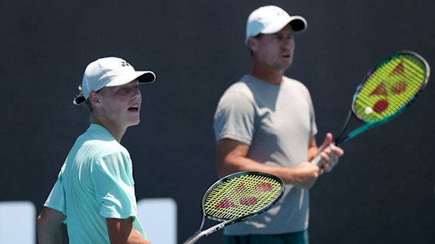 Lleyton and Cruz Hewitt play doubles during an Alex de Minaur training session.