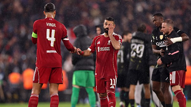 Virgil van Dijk and Mohamed Salah of Liverpool look dejected after the team's defeat.