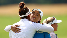 Hannah Green (L) and Minjee Lee (R) hug on the 18th green.