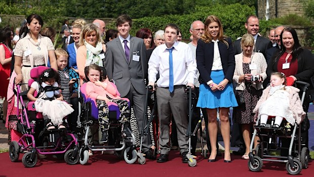 Princess Beatrice poses for photographs with children and families at the end of her visit to the Forget Me Not Children Hospice in Huddersfield. 