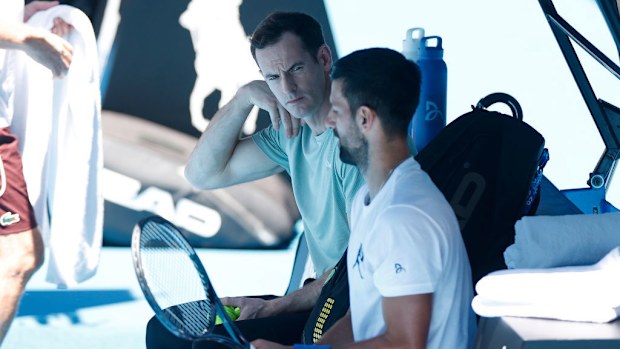 Novak Djokovic of Serbia and his coach Andy Murray are seen during a practice session.