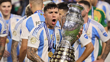 Enzo Fernandez celebrates with the trophy after the Copa America final.