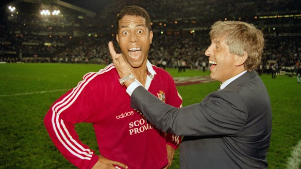 Lions hero Jeremy Guscott celebrates with coach Ian McGeechan.