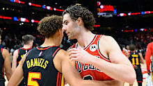 Dyson Daniels (L) and Josh Giddey (R) embrace after the game.