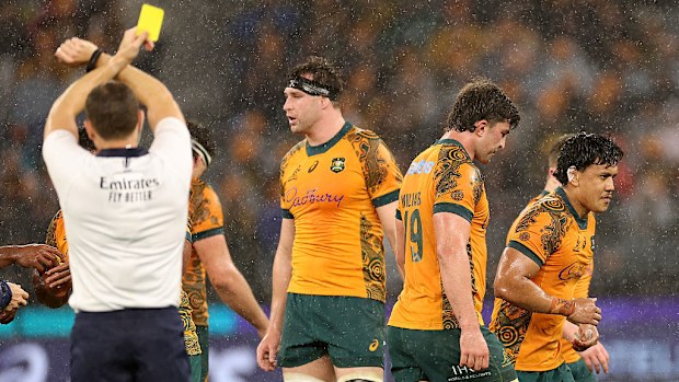 Len Ikitau of the Wallabies leaves the field after receiving a yellow card.