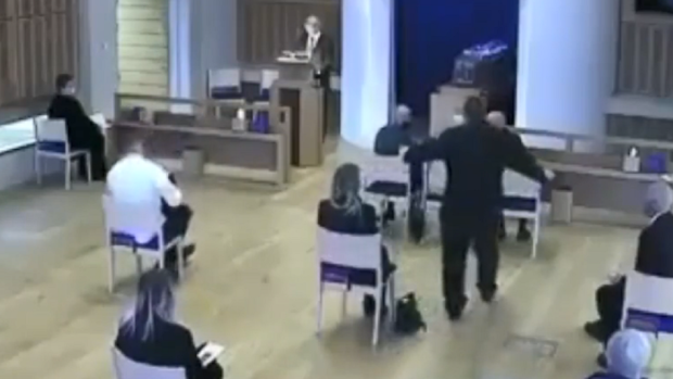 It is then that the funeral attendant steps forward and tells them to move apart.
