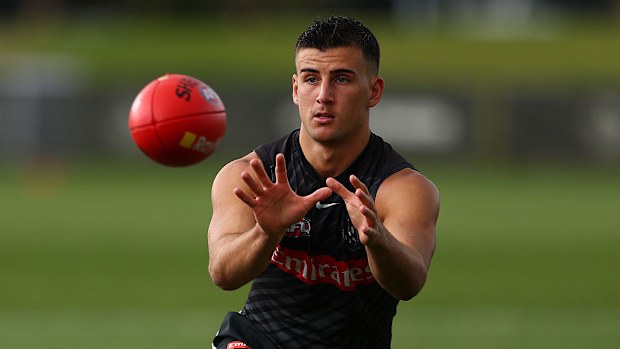 Nick Daicos takes a mark at training.