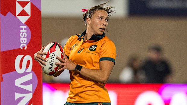 Teagan Levi of Australia scores a try against Great Britain.