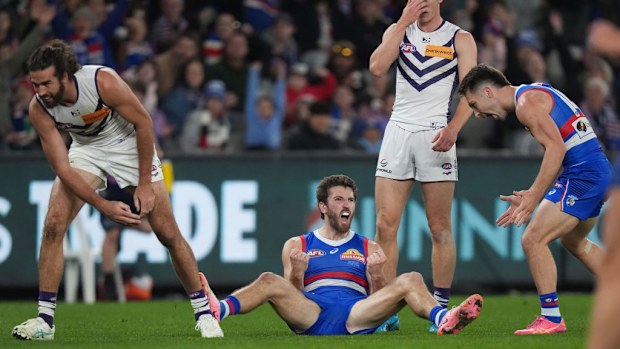 Western Bulldogs and Fremantle Dockers; Marcus Bontempelli celebrates kicking a goal.