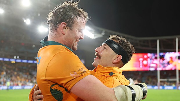 Harry Wilson of the Wallabies embraces teammate Nic White after the team's victory.