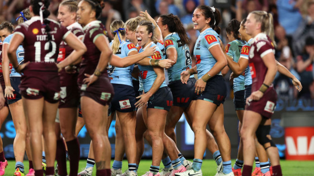 Emma Tonegato of the Blues celebrates a try.