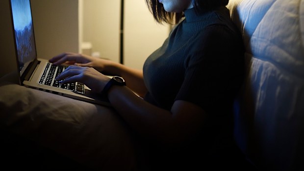 Woman using computer online