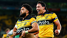 Fehi Fineanganofo of the Hurricanes celebrates with Billy Proctor after scoring a try.