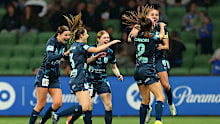 Shea Conn­ors celebrates with her teammates after scoring.