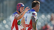 Kalyn Ponga of the Knights celebrates scoring a try with team mate Bradman Best.