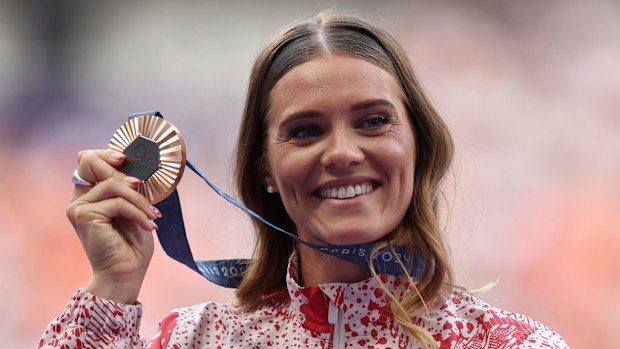 Alysha Newman celebrates bronze in the Women's Pole Vault final.