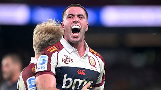 Joe Brial of the Reds celebrates after scoring a try.