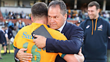 Wallabies head coach Dave Rennie embraces Dave Porecki.