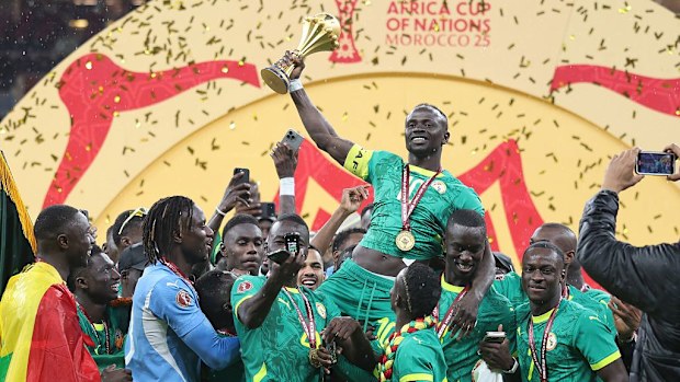 Senegalese players raise the trophy after winning the 35th Africa Cup of Nations.