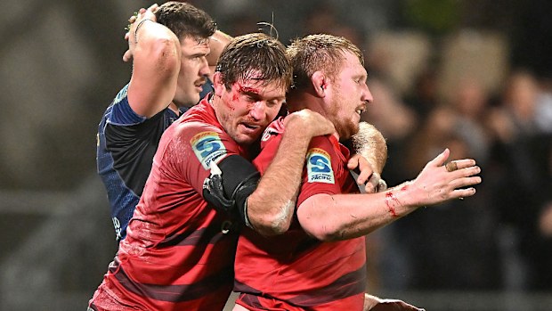 Ethan Blackadder and Fletcher Newell of the Crusaders celebrate.