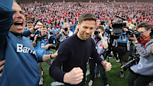 Xabi Alonso of Bayer Leverkusen celebrates the German championship.