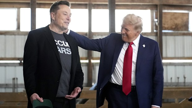 Tesla and SpaceX CEO Elon Musk, left, and Donald Trump attend a campaign event at the Butler Farm 