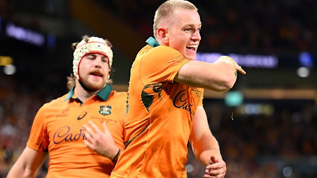 Max Jorgensen of the Wallabies celebrates scoring a try.