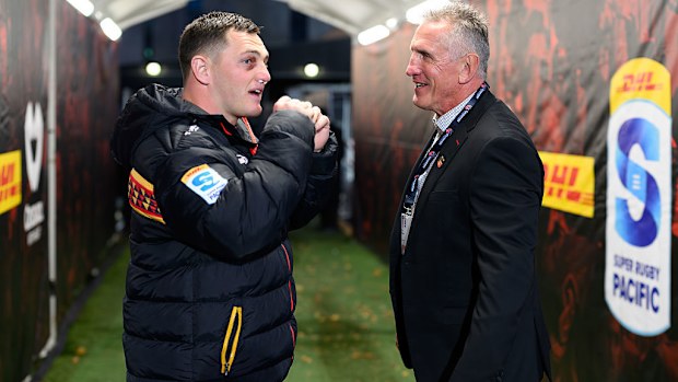 Brodie McAlister of the Chiefs and coach Rob Penney of the Crusaders.