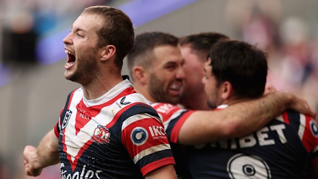 Sam Walker celebrates a try by team mates Victor Radley.